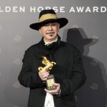 Hong Kong actor Anthony Wong holds his award for best actor at the Golden Horse Awards in Taipei, Taiwan on Saturday. Photo: AP