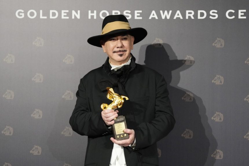 Hong Kong actor Anthony Wong holds his award for best actor at the Golden Horse Awards in Taipei, Taiwan on Saturday. Photo: AP