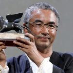 Pema Tseden with the trophy for best screenplay at the 2018 Venice Film Festival. Photo: Getty Images