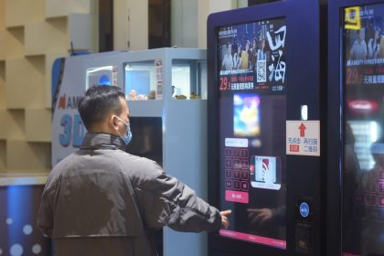 A man buys a film ticket at a cinema in Hangzhou, Zhejiang province. Photo: Getty Images