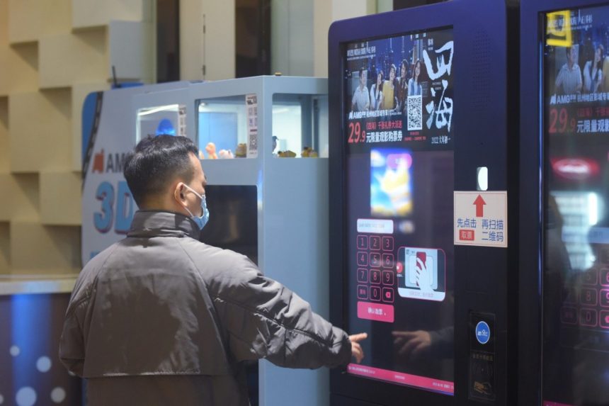 A man buys a film ticket at a cinema in Hangzhou, Zhejiang province. Photo: Getty Images