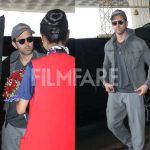 Hrithik Roshan arrived at the airport in a relaxed grey look, greeted with a bouquet as he made his way inside.
