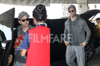 Hrithik Roshan arrived at the airport in a relaxed grey look, greeted with a bouquet as he made his way inside.