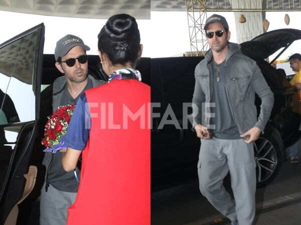 Hrithik Roshan arrived at the airport in a relaxed grey look, greeted with a bouquet as he made his way inside.