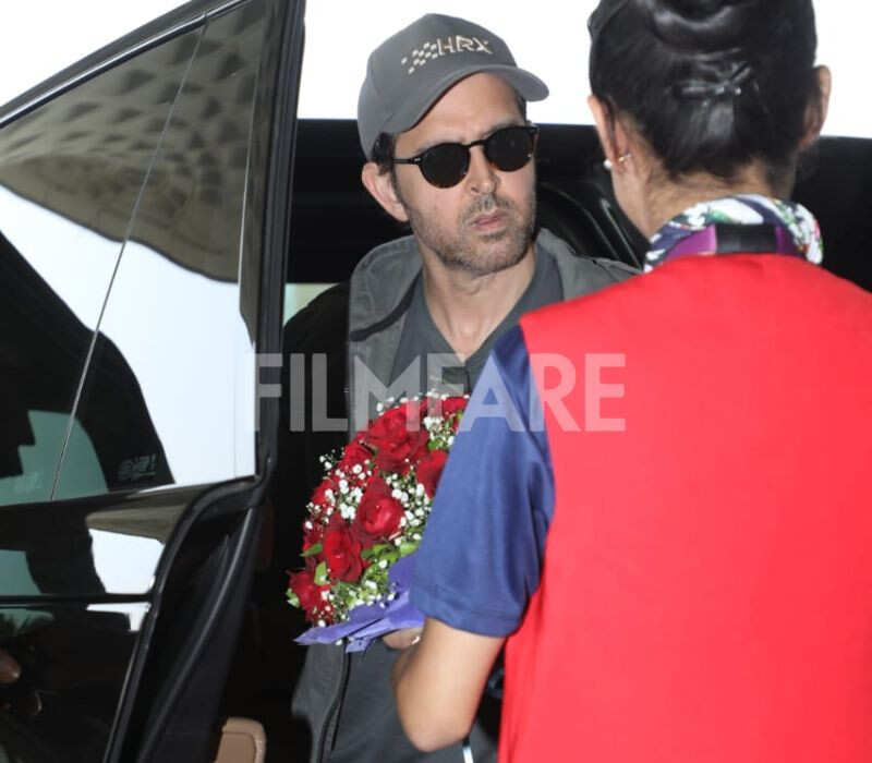 Hrithik Roshan was seen arriving at the airport, where he was welcomed with a bouquet as he stepped out of his car. He kept h